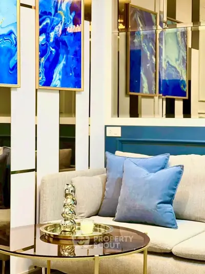 Stylish modern living room with abstract art and cozy sofa