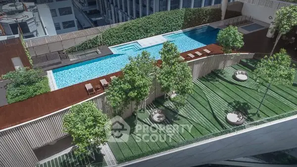 Luxurious rooftop pool with lush greenery and modern design in urban setting.
