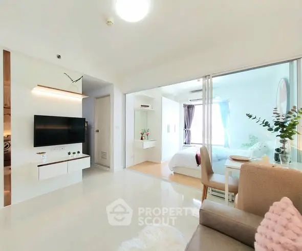 Modern open-plan living room with sleek decor and natural light