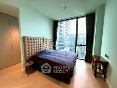 Luxurious bedroom with floor-to-ceiling windows and stunning city view in modern high-rise apartment.