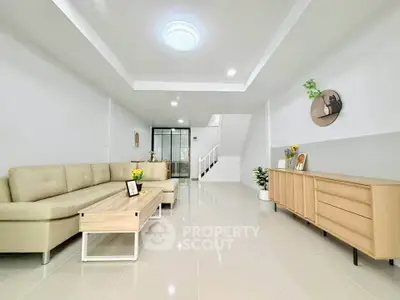 Spacious modern living room with sleek furniture and bright lighting