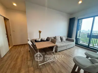 Modern living room with dining area and balcony view in a stylish apartment.