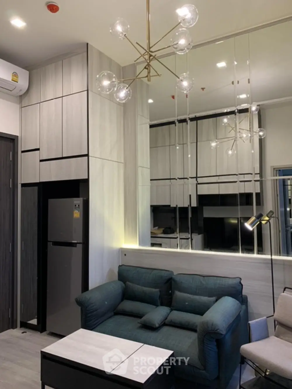 Modern living room with stylish lighting and sleek furniture