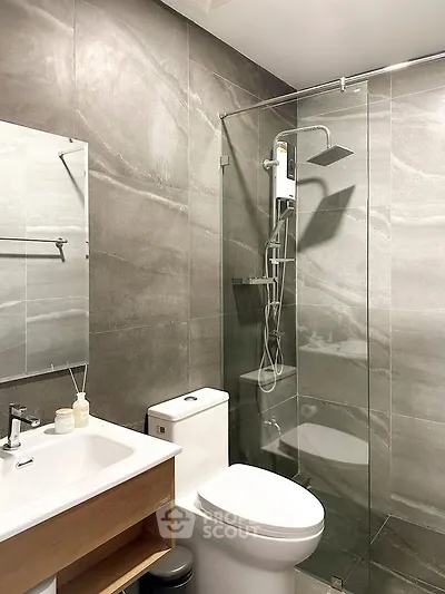 Modern bathroom with glass shower and sleek fixtures