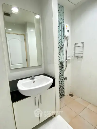 Modern bathroom with sleek sink and shower in a stylish apartment