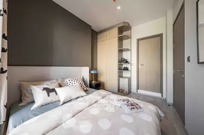 Modern bedroom with stylish decor and ample storage space