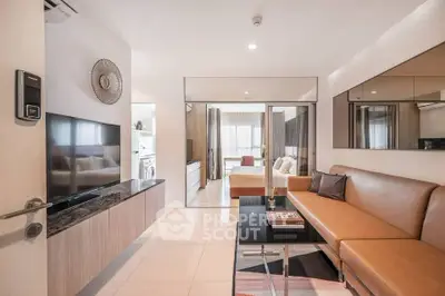 Modern living room with sleek design and open view to bedroom