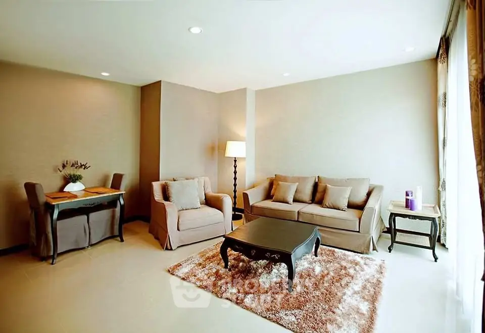 Spacious living room with cozy seating and elegant decor