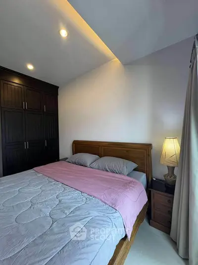 Cozy bedroom with wooden furniture and soft lighting