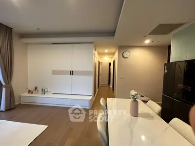 Modern open-plan living area with sleek kitchen and stylish dining space