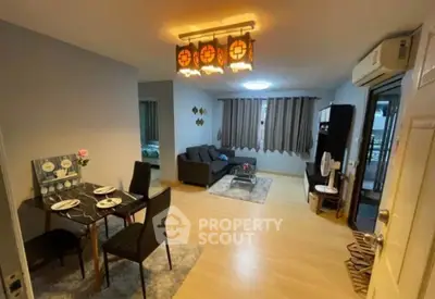 Spacious open-plan living and dining area with modern decor and natural light.