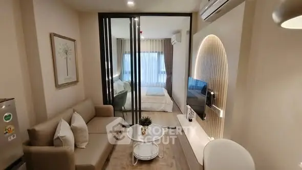 Modern living room with stylish decor and cozy bedroom view