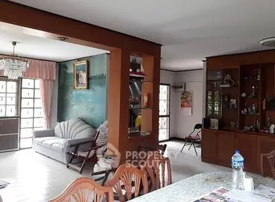 Spacious living room with elegant wooden furniture and natural light