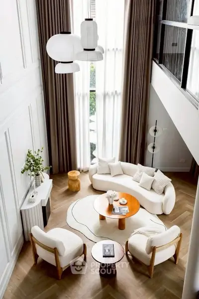 Luxurious modern living room with high ceilings and elegant decor