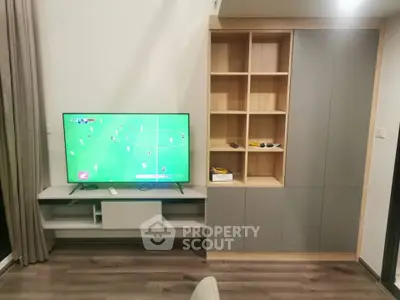 Modern living room with sleek TV unit and stylish shelving, perfect for entertainment and storage.