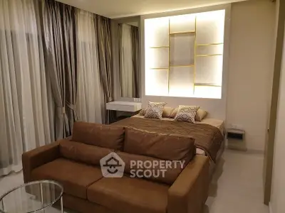 Luxurious studio apartment with elegant decor and cozy seating area