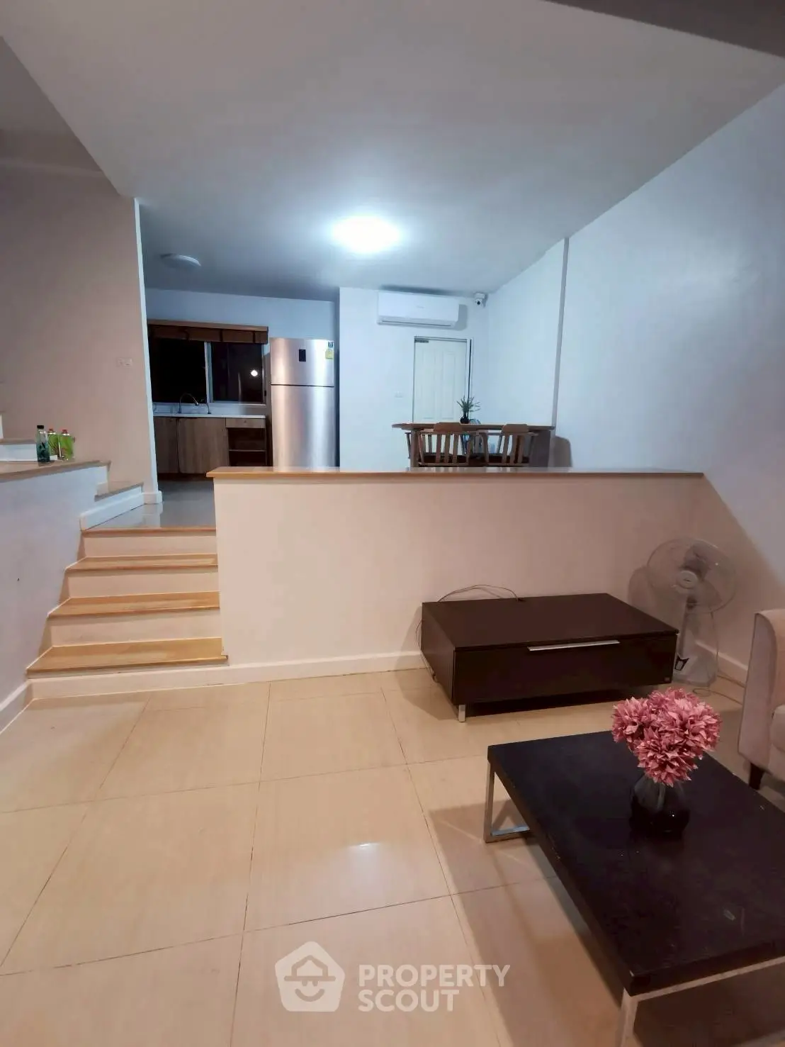 Spacious open-plan living area with modern kitchen and stylish decor