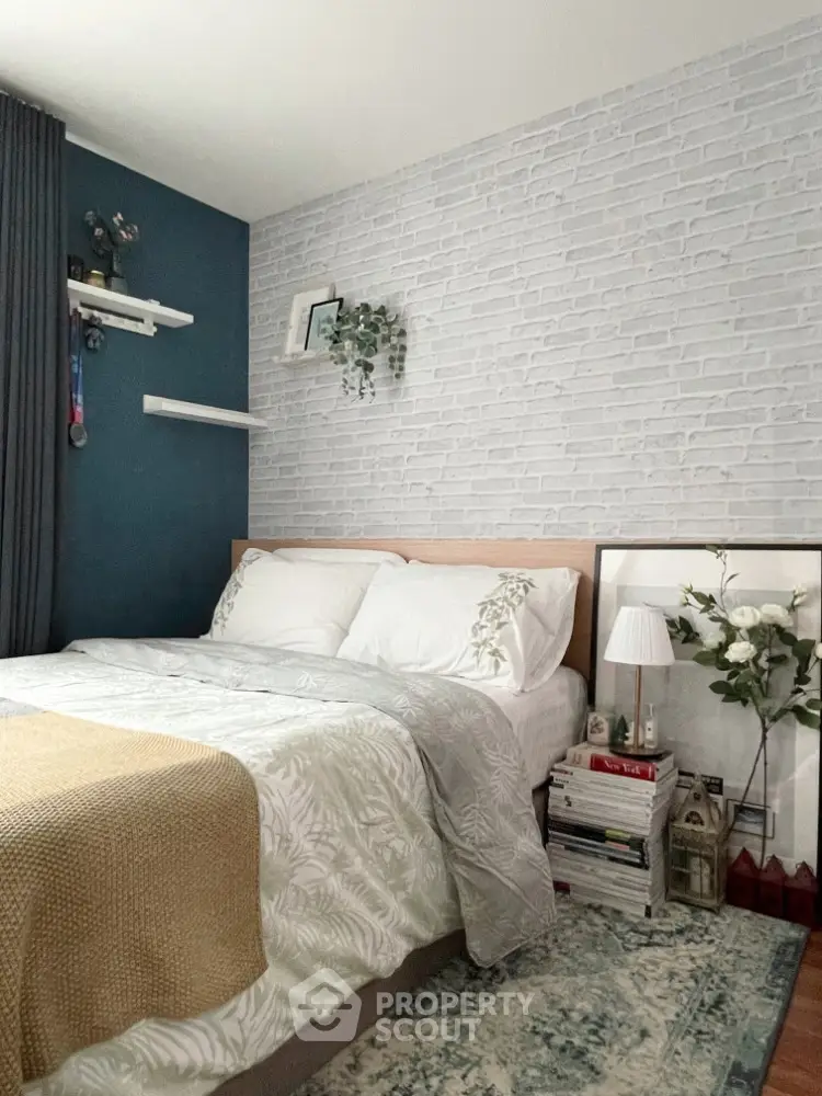 Cozy bedroom with modern decor and stylish brick accent wall