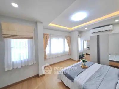 Bright and cozy bedroom with modern decor and natural light