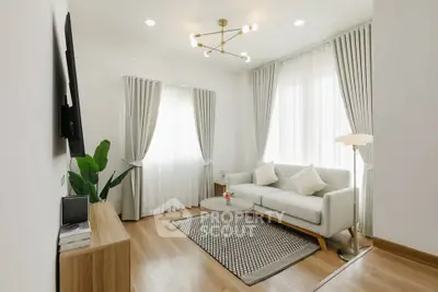 Elegant living room with modern decor and natural light