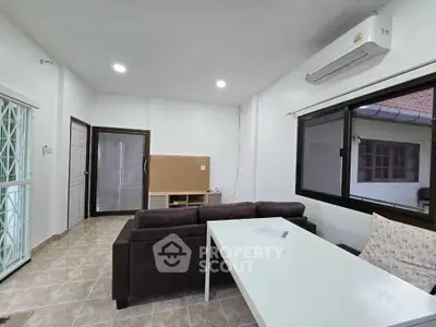 Spacious living room with modern air conditioning and natural light
