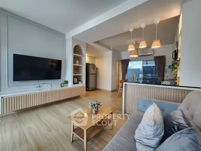Modern living room with stylish decor, open layout, and natural light.