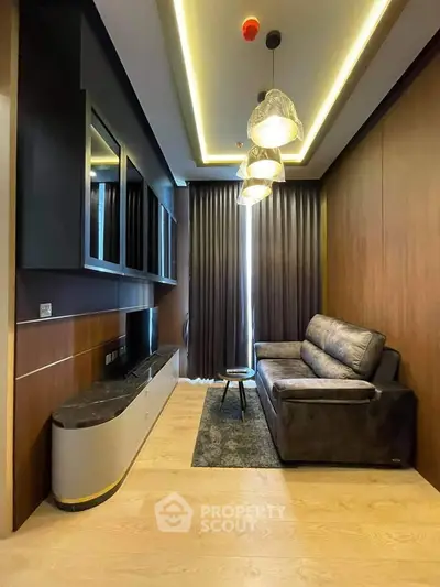 Modern living room with sleek design, featuring a cozy sofa, stylish lighting, and elegant wood paneling.