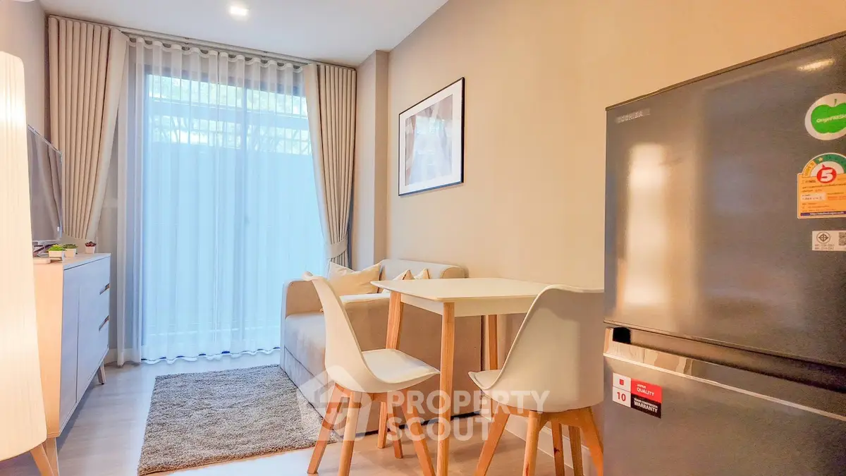 Cozy living room with modern furniture and natural light, perfect for relaxation and entertaining.