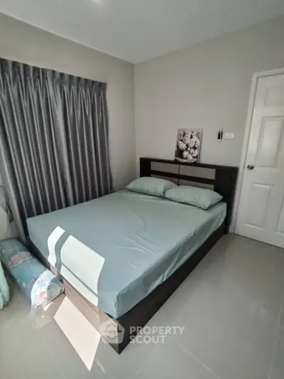 Cozy bedroom with modern decor and natural light