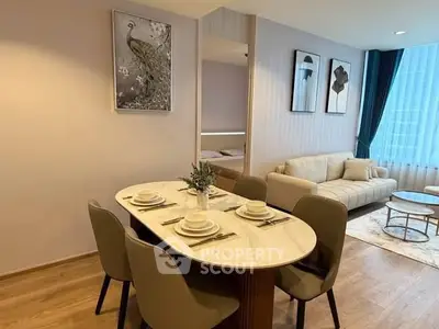 Elegant dining and living area with modern decor and natural light