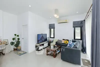 Modern living room with sleek design and cozy seating area