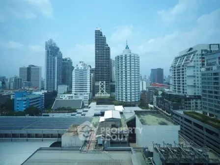 Stunning cityscape view of modern skyscrapers under a clear blue sky, showcasing urban living at its finest.