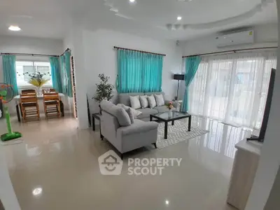 Spacious living room with modern decor and natural light