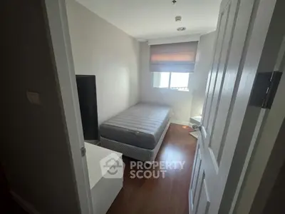 Cozy small bedroom with natural light and minimalist decor