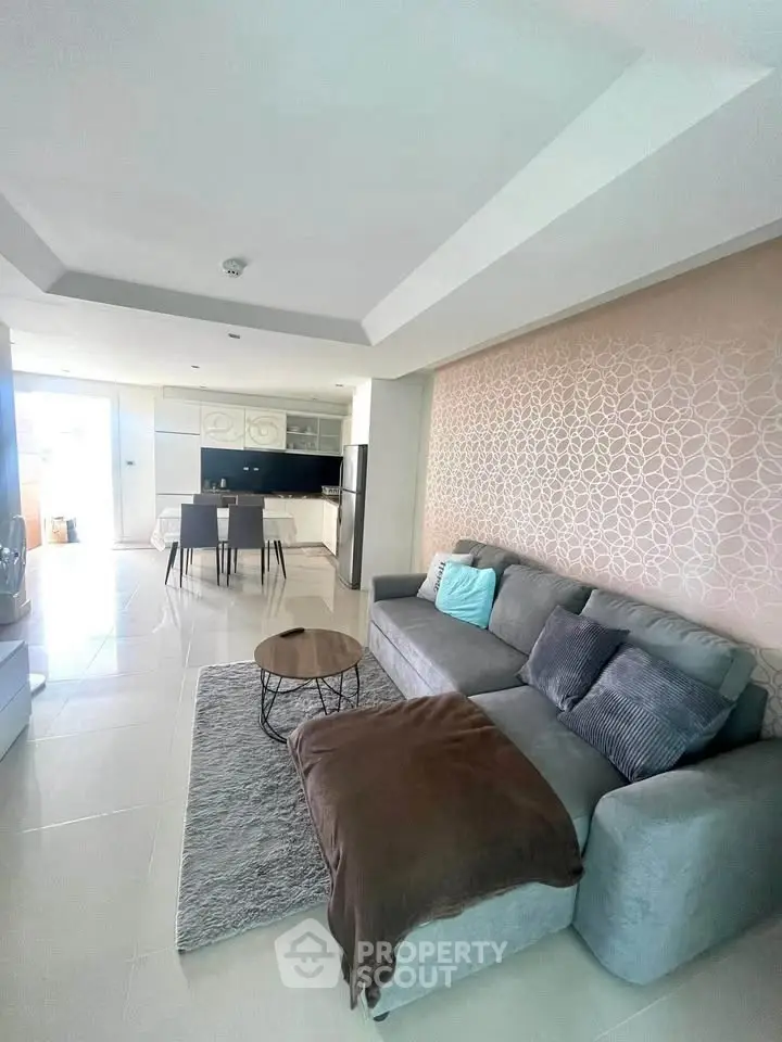 Modern living room with stylish decor and open kitchen layout