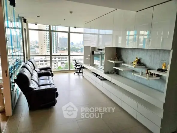 Spacious modern living room with city view and sleek furnishings