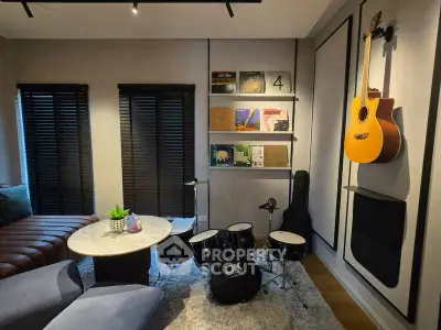 Stylish music-themed living room with drum set and guitar, perfect for creative relaxation.