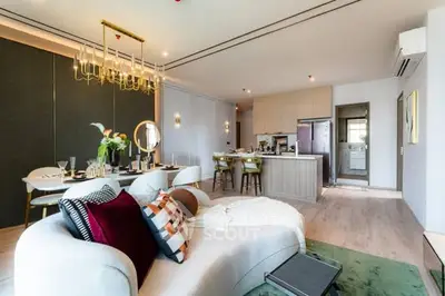 Luxurious open-plan living room with elegant decor and modern kitchen