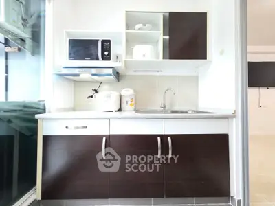 Modern kitchen with sleek cabinets and appliances, perfect for urban living.