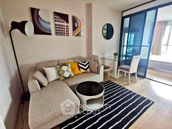 Modern living room with stylish decor and cozy seating area in a contemporary apartment.