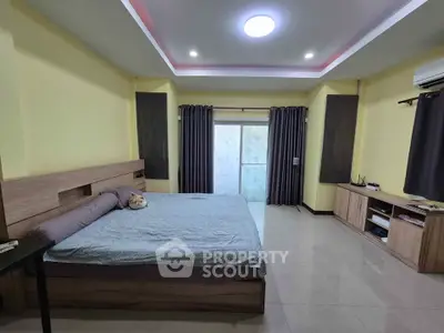 Spacious bedroom with modern design and ample natural light