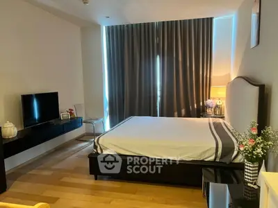 Modern bedroom with sleek furniture and ambient lighting