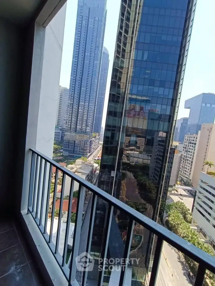 Stunning cityscape view from a high-rise balcony, showcasing modern skyscrapers and urban skyline.