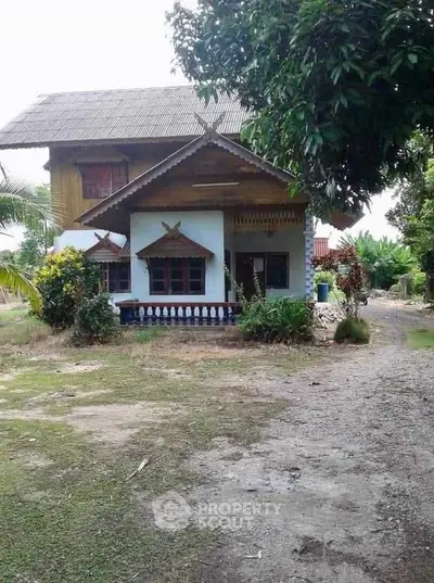 Charming rustic house with traditional architecture and lush greenery