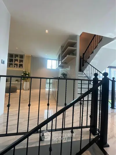 Modern interior with stylish staircase and open living area