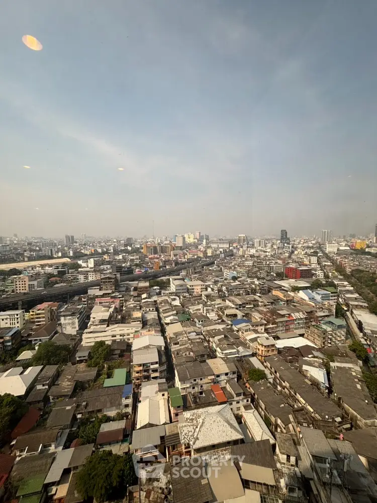 Stunning panoramic cityscape view from high-rise building showcasing urban skyline and vibrant city life.