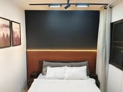 Cozy bedroom with modern lighting and stylish decor