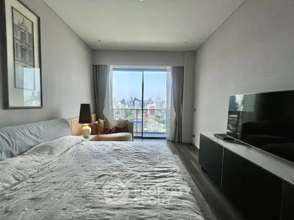 Luxurious bedroom with stunning city view and modern decor