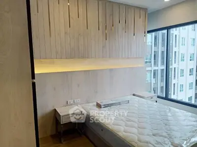 Modern bedroom with large window and stylish wooden paneling