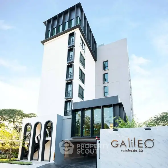 Modern apartment building with sleek design and large windows at Galileo Ratchada 32.